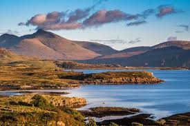 Scottish coastline with hills and calm blue water